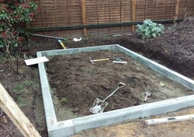 A before photo of a garden during landscaping construction