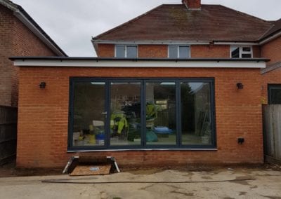 Photo of a house from the back during construction