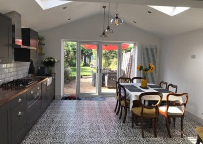 Photo of a kitchen and dining room, with Sunflowers on the table