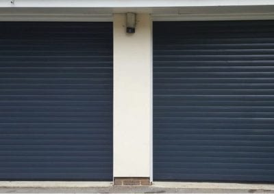 Two navy garage doors